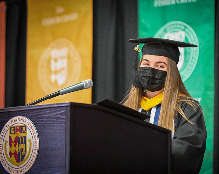 Graduate Taylor Fink offers remarks during the School of Nursing Commencement ceremony.
