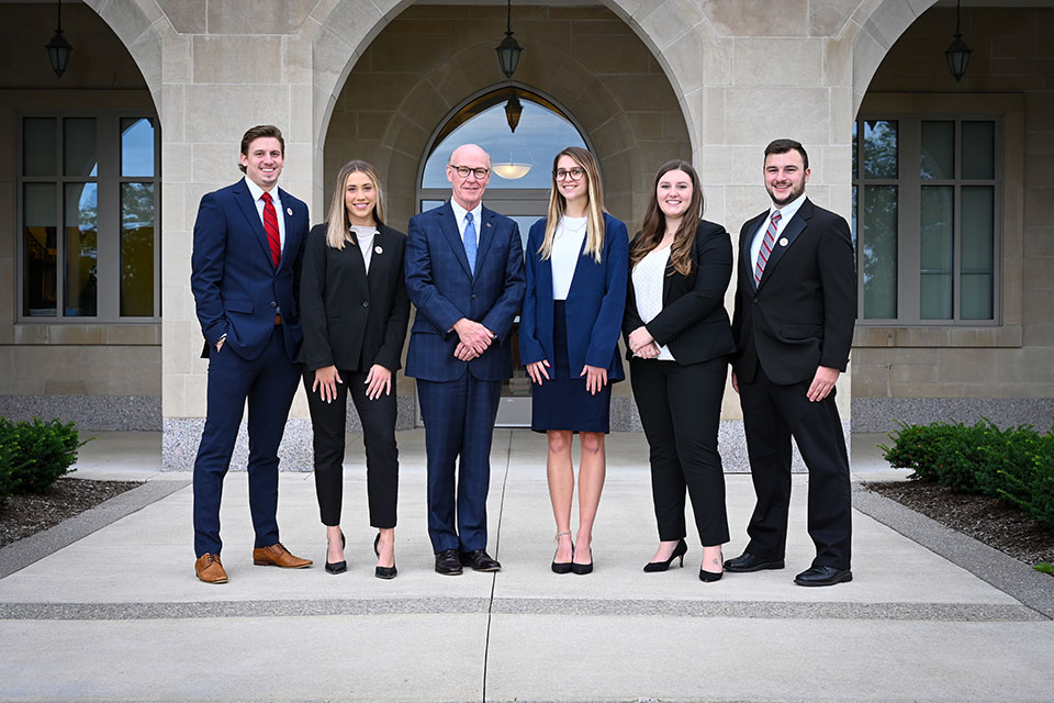 The 2021-2022 Executive Interns with President Rooney (center).