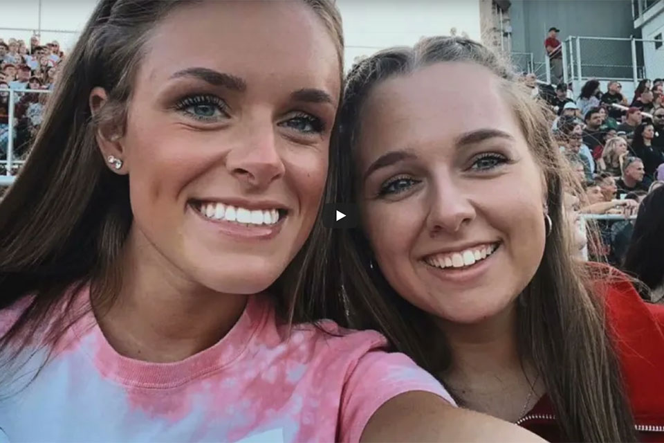 Alyssa Gara and a friend at a Cardinals football game.