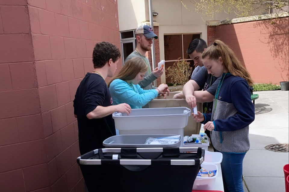 Students volunteering at a site in Houston during the 2020 service trip.