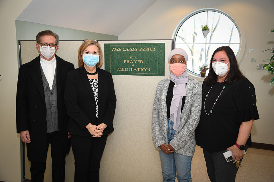 From left to right: Fr. Kevin Mannara, Dr. Tricia Gatlin, mental health counseling student Oumou Wague, and Dr. Gail Bagley.