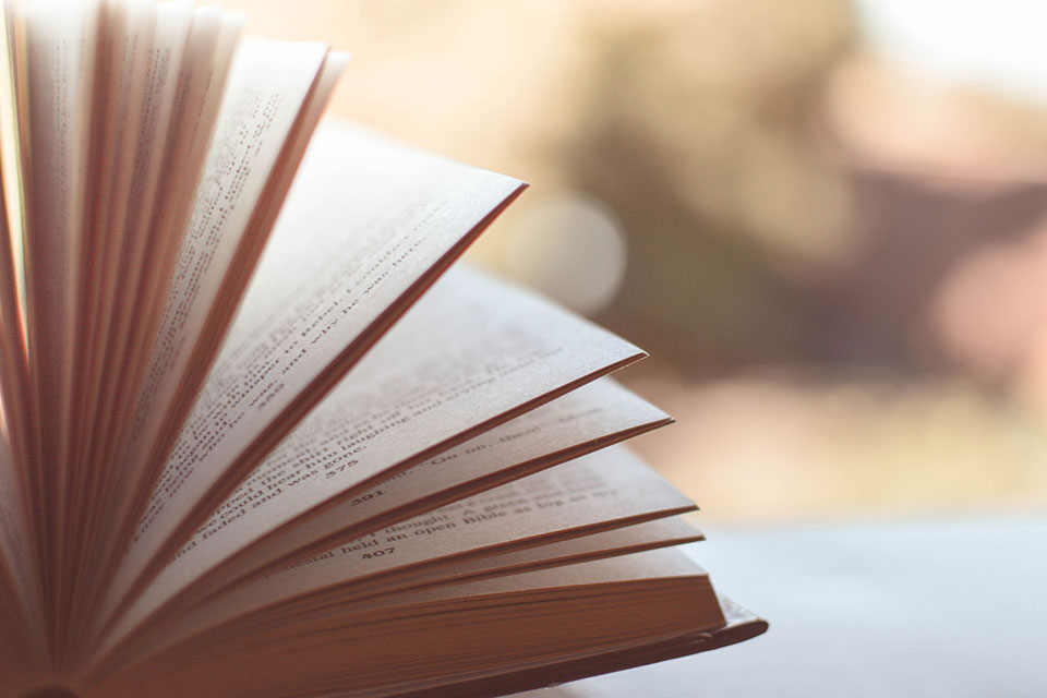 An open book rests on a table.