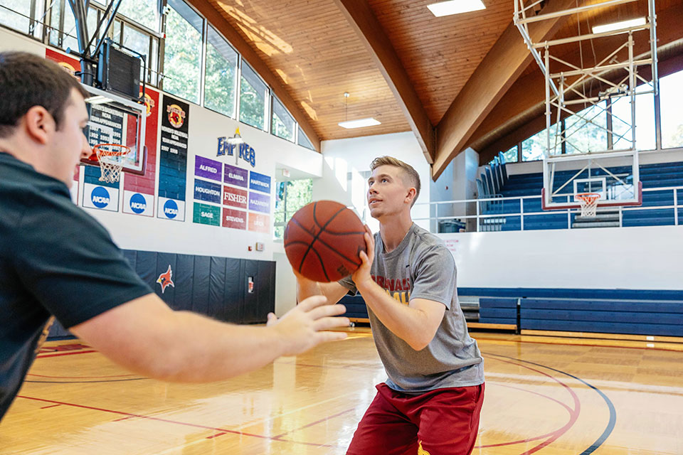 Fisher students play a game of pick-up basketball.