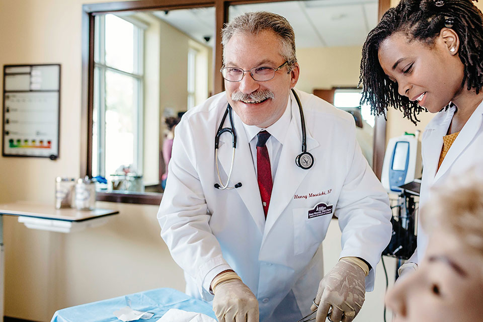 Faculty and students in the Glover-Crask Simulation Center.