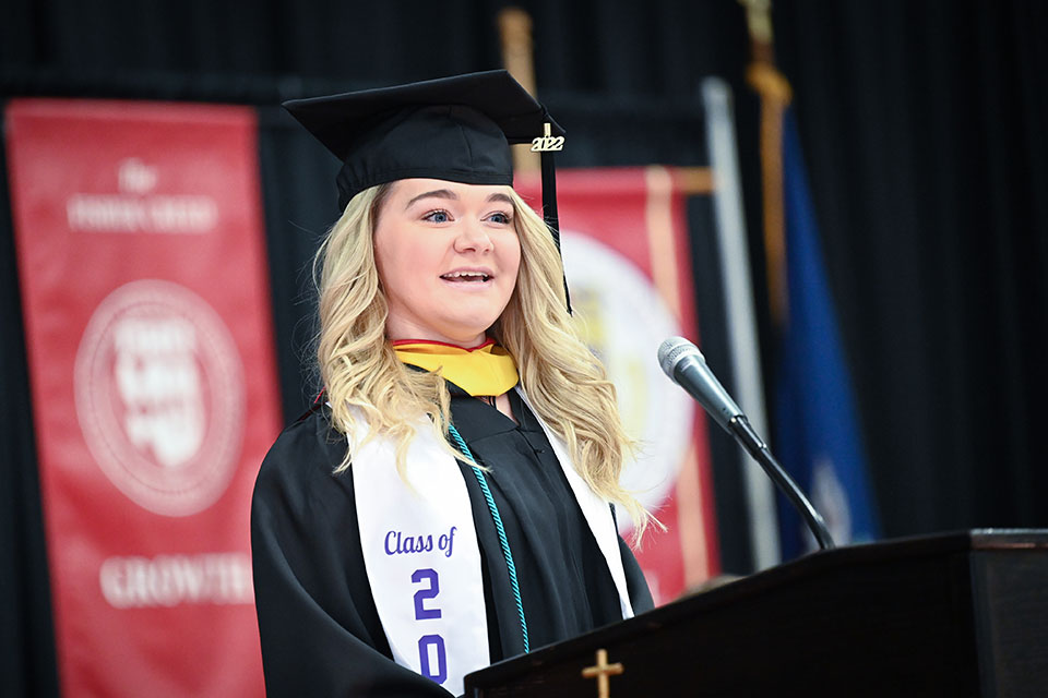 Graduating senior Sarah Storsberg addresses her fellow classmates during the School of Business Commencement ceremony.