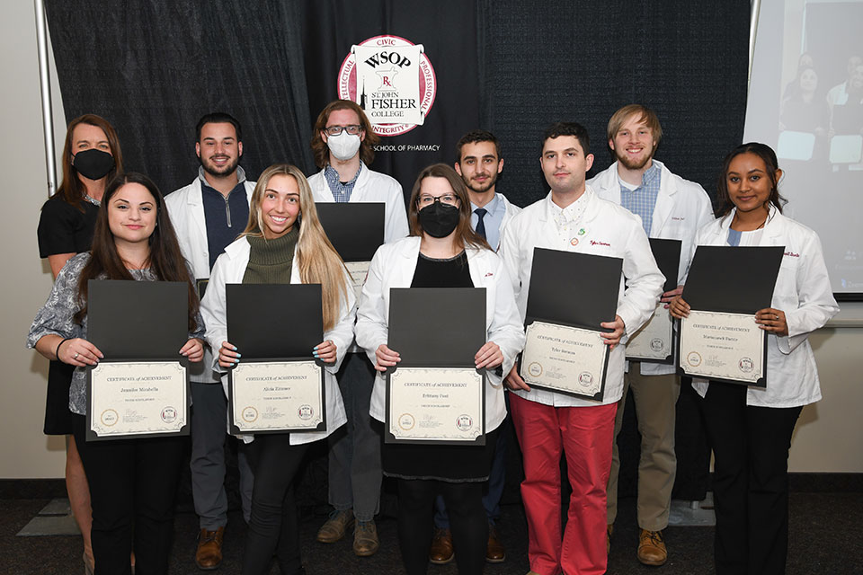 The recipients of the Alvin F. and Ruth K. Thiem Foundation Scholarships with Dean Christine Birnie.