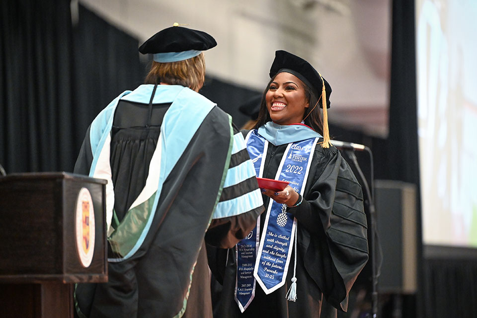 A graduate of the Ed.D. program crosses the stage at Commencement.