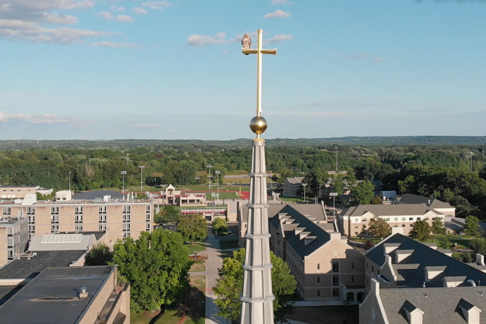 A hawk perches on the Kearney Steeple.