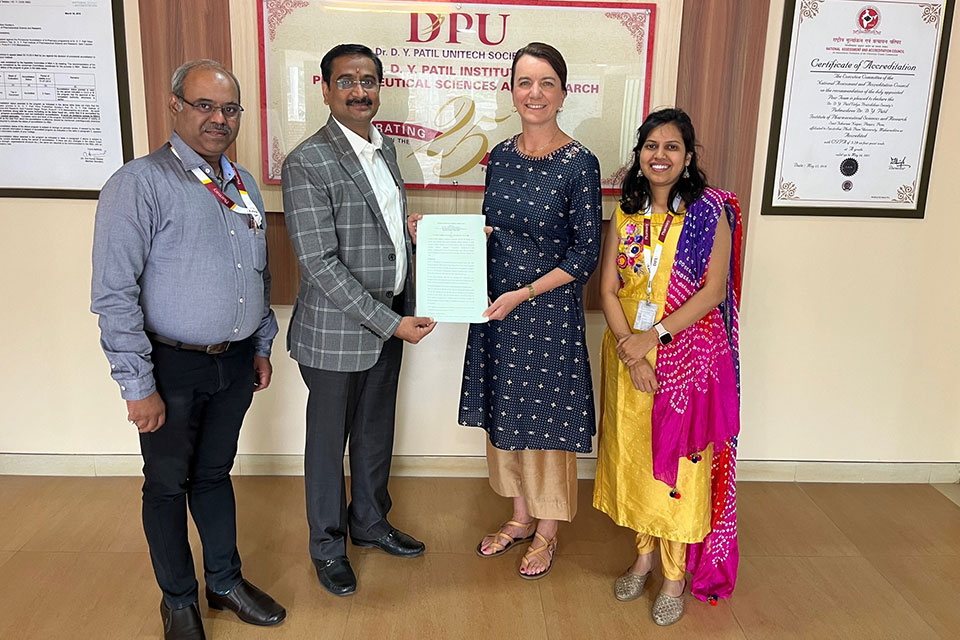 Dr. Christine Birnie (second from the right) with officials from the Dr. D.Y. Patil Institute of Pharmaceutical Sciences and Research in Pune, India.