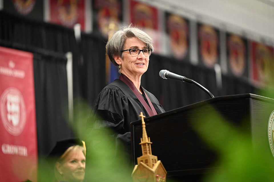 President's Medal recipient Ann Costell addresses the graduates.