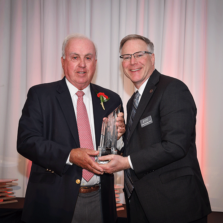 Neal Golding accepts the Accounting Lifetime Achievement Award from School of Business Dean Dan Connolly.
