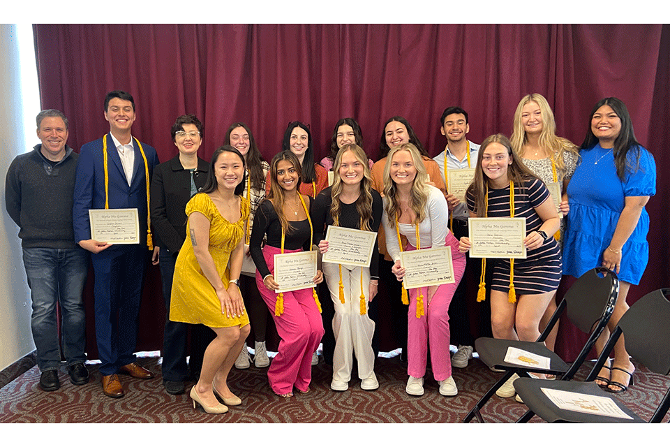 Members of Alpha Mu Gamma honor society.