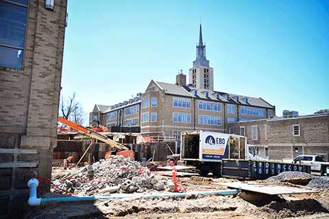 Crews work on the exterior of Lavery Library.