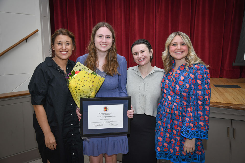 Members of the Alumni Engagement team with a student award winner.