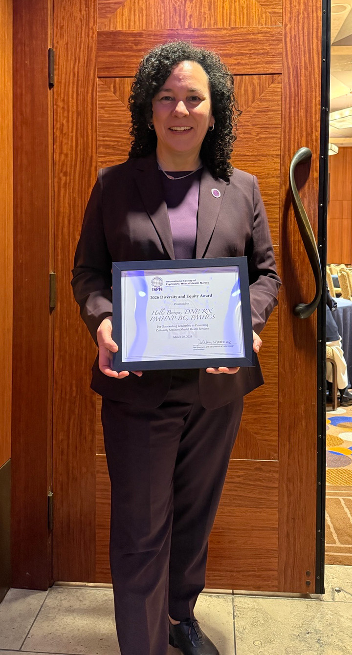 Dr. Holly Brown with her ISPN Diversity and Equity Award.