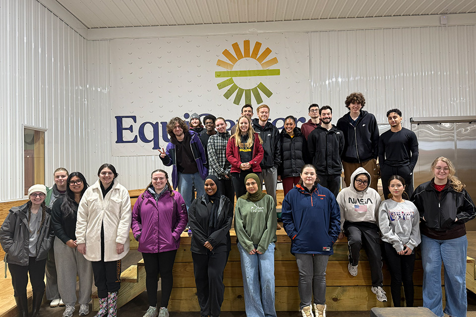 Fisher Pharmacists pose for a group photo while volunteering at the Equicenter.