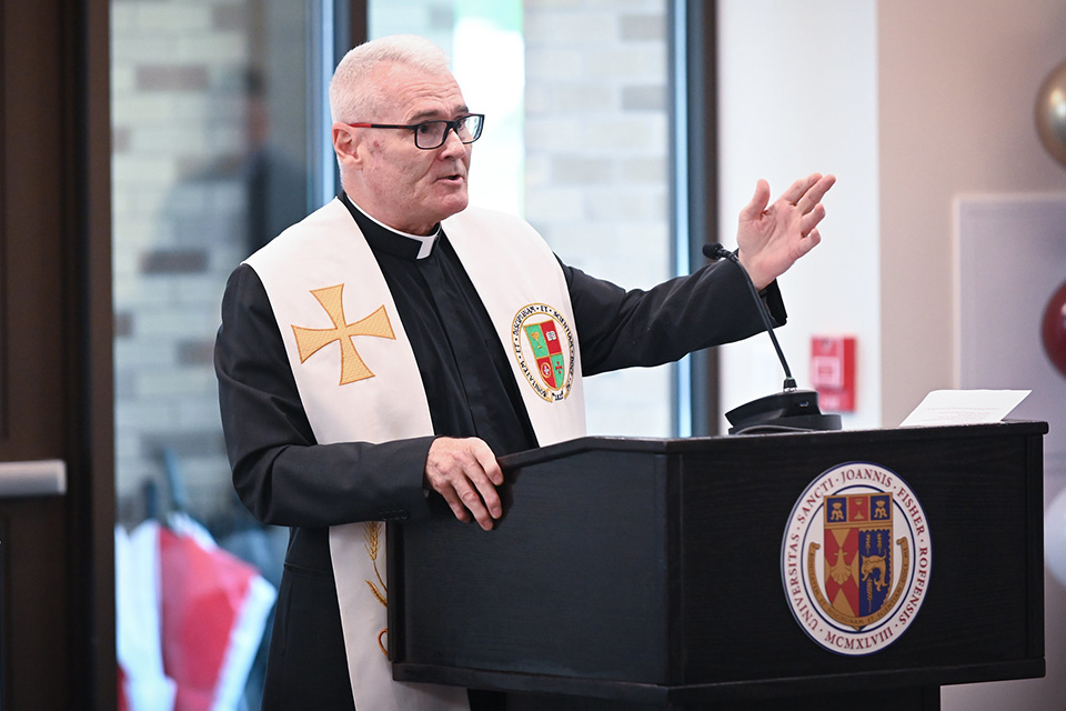 Fr. George Smith speaks to a group.