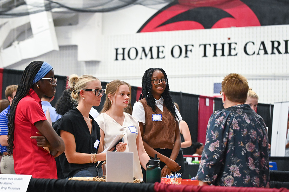 Students attend a Career Fair at St. John Fisher University to meet employers.