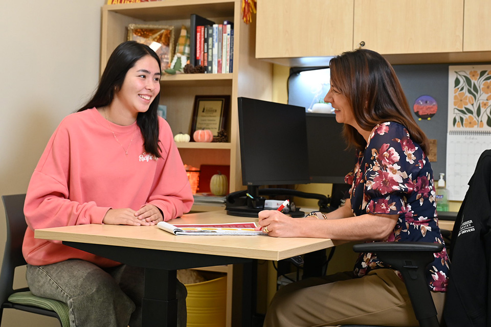 A student meets with a member of the career services team.