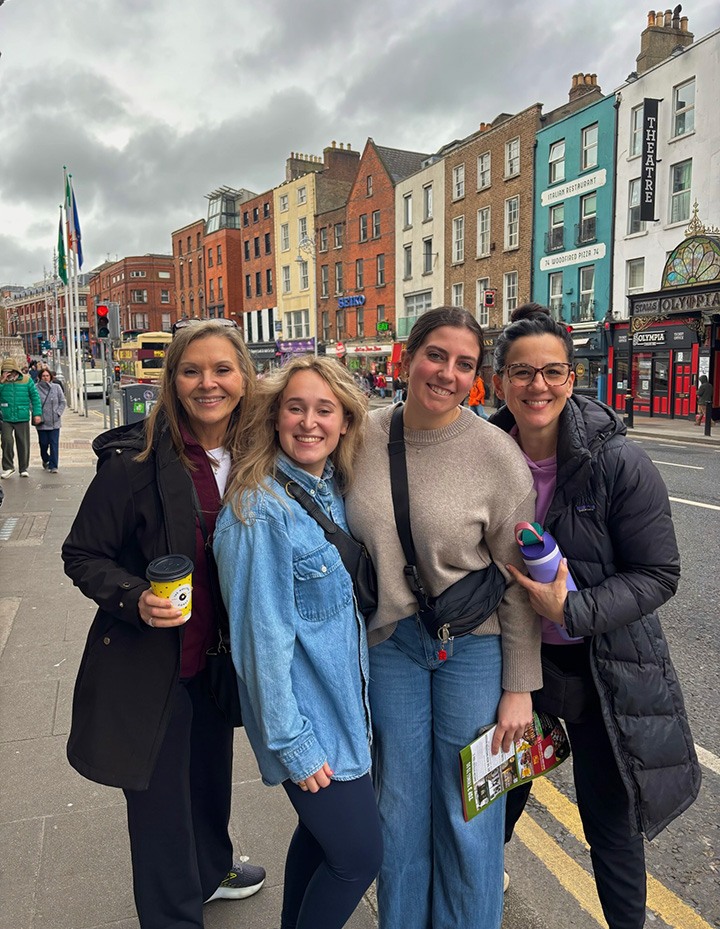 Gabriella Lawrence and Brynn Calvert with Dean Gatlin and Dr. Hogan exploring the streets of Ireland.