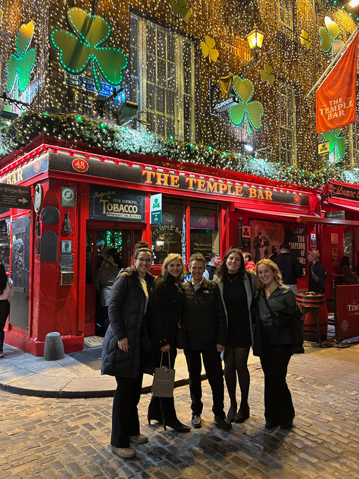 Fisher Nursing team in front of an Irish pub.