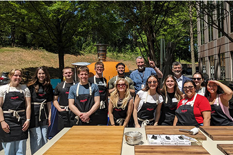 Students posing at the cooking demonstration during Fisher Flight