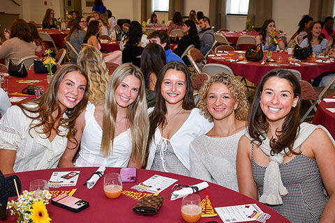 A group of female students sitting at a table