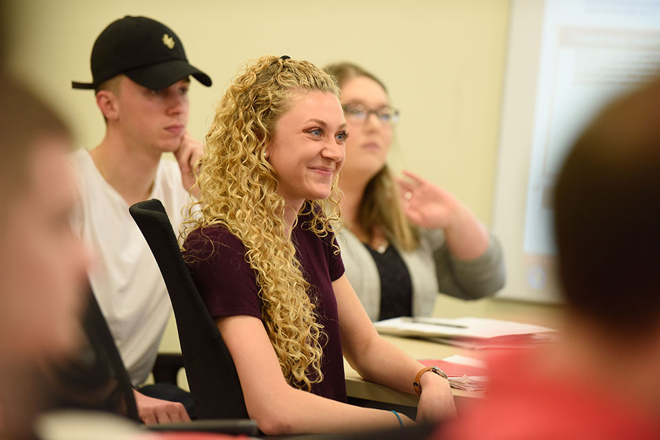 A student in a classroom in the School of Business.