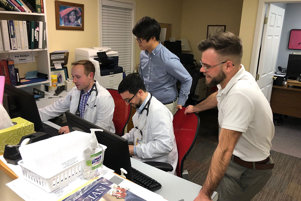 Pharmacy students and medical students from the University of Rochester work together to treat patients at the UR Well Clinic.