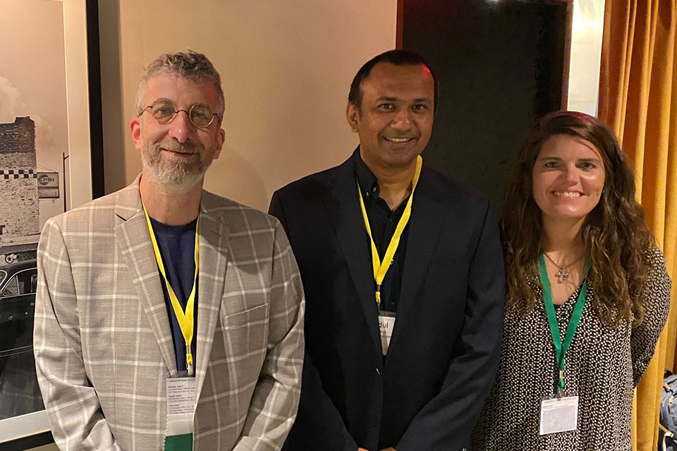 Professor Sarachan along with Teacher of the Year, Masudal Biswas of Loyala University-Maryland and Mary Liz Brooks, co-host of the event with Sarachan, of West Texas A&M University.