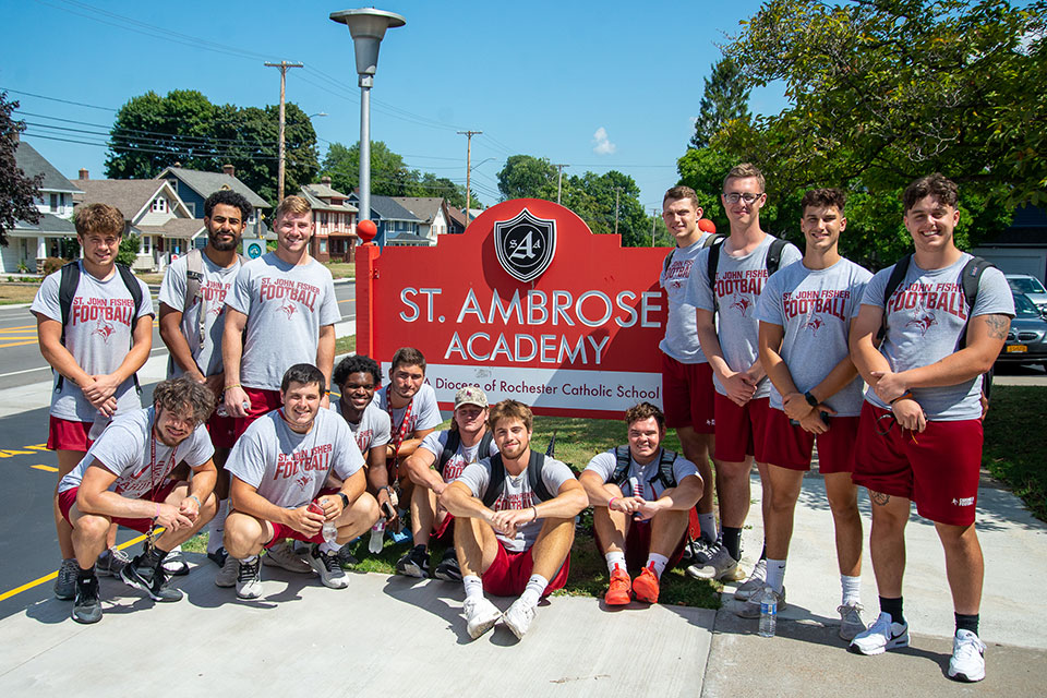  Several members of the football team spent their day volunteering at St. Ambrose Academy during the annual Cardinal Community Blitz. 