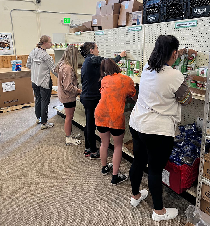 Students help stock healthy foods at Blackfeet Reservation in Montana.