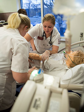 Nursing students working in one of the School's simulated laboratories.