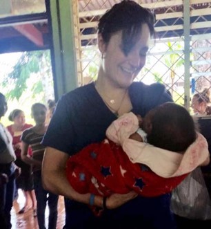 Amy Parkhill holding a baby.