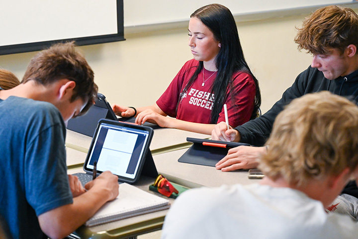 Students using iPads in a Classroom.