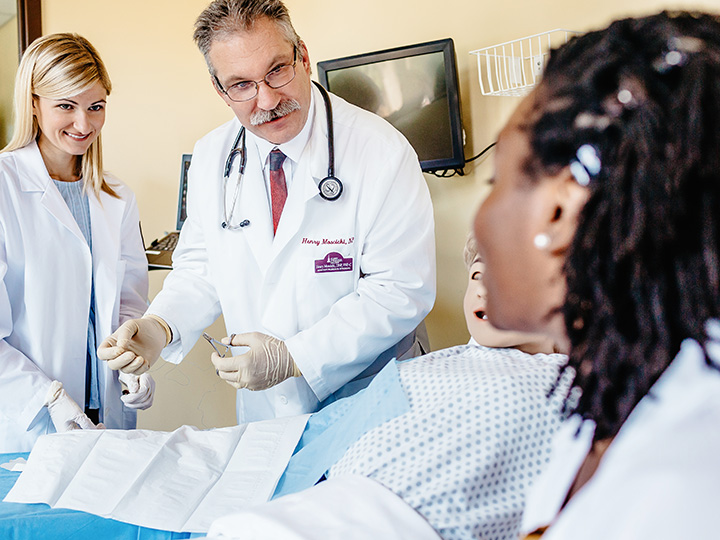 Nursing students practice skills in a simulation center.