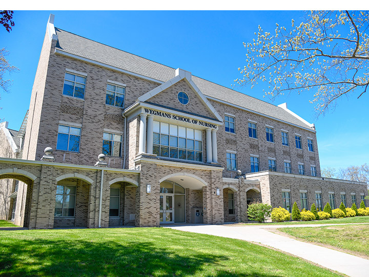 Wegmans School of Nursing building in spring.