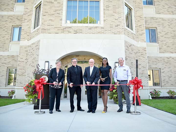 Members of the Fisher Community gather for the ribbon cutting of the Upper Quad Residence Hall.