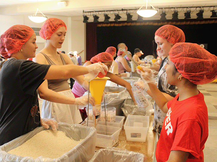 The Service Scholars Program creates opportunities for community engagement such as this meal packaging project in the movement to end hunger.