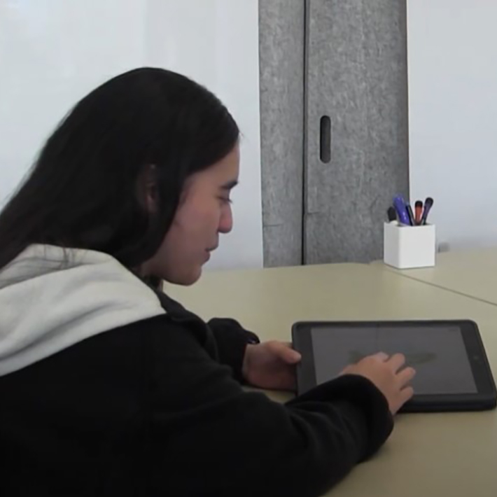 A student shows the ebook she made using her iPad.