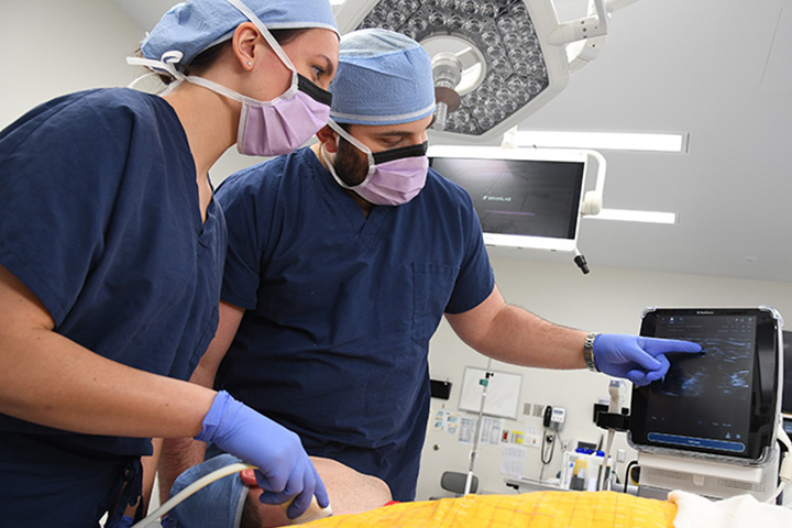 CRNA students practice in a simulation experience.