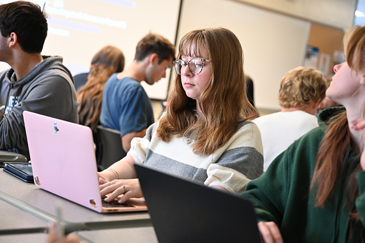 Professor writting on white board