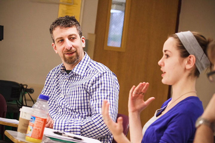 Dr. Sarachan speaking with a student.