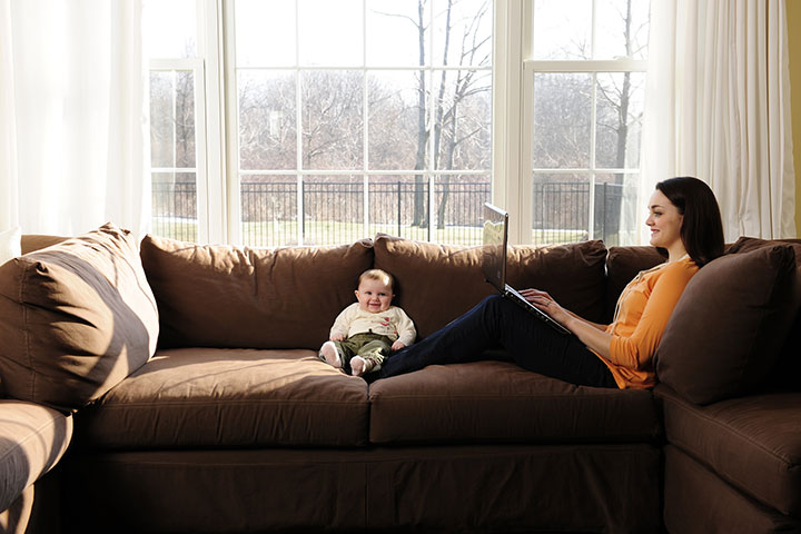 A student working from home with her child