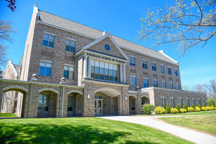 The Wegmans School of Nursing building in spring.