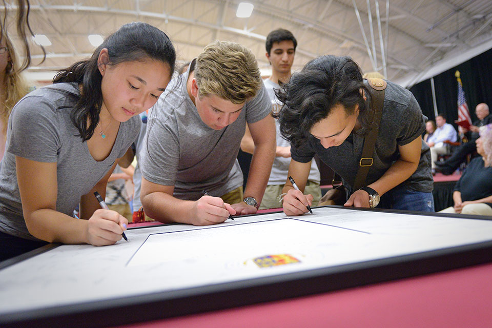 Students sign the Fisher Creed during their first year.