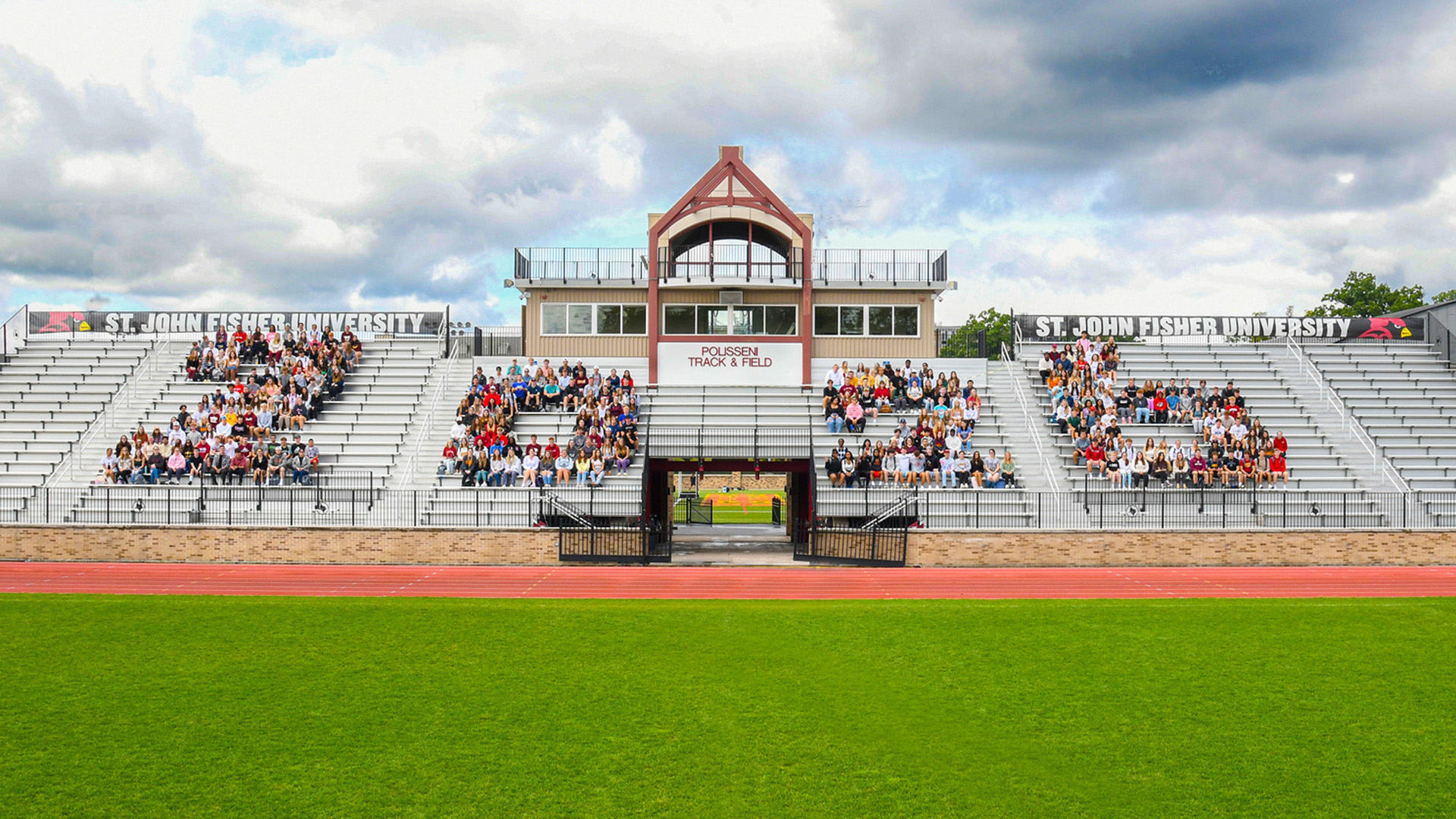 Class of 2026 seated on bleachers.