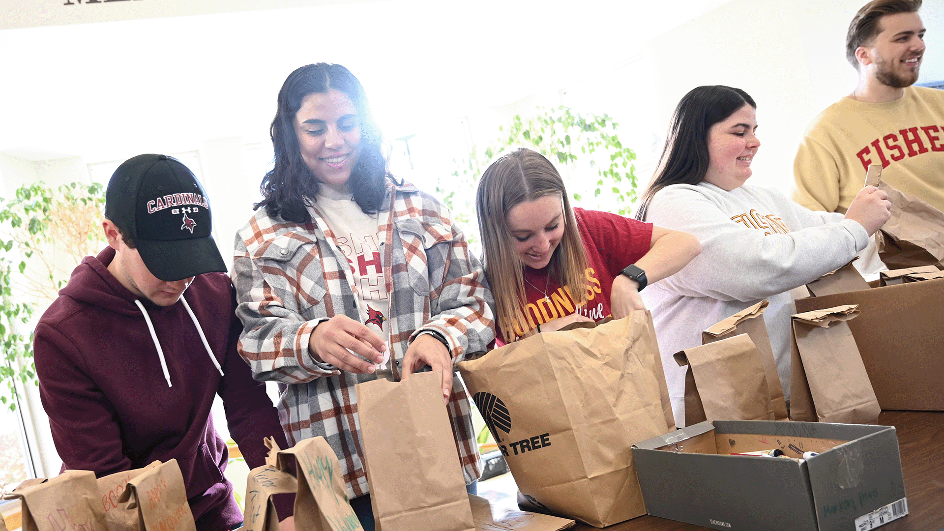 Students pack bags for a community service project.