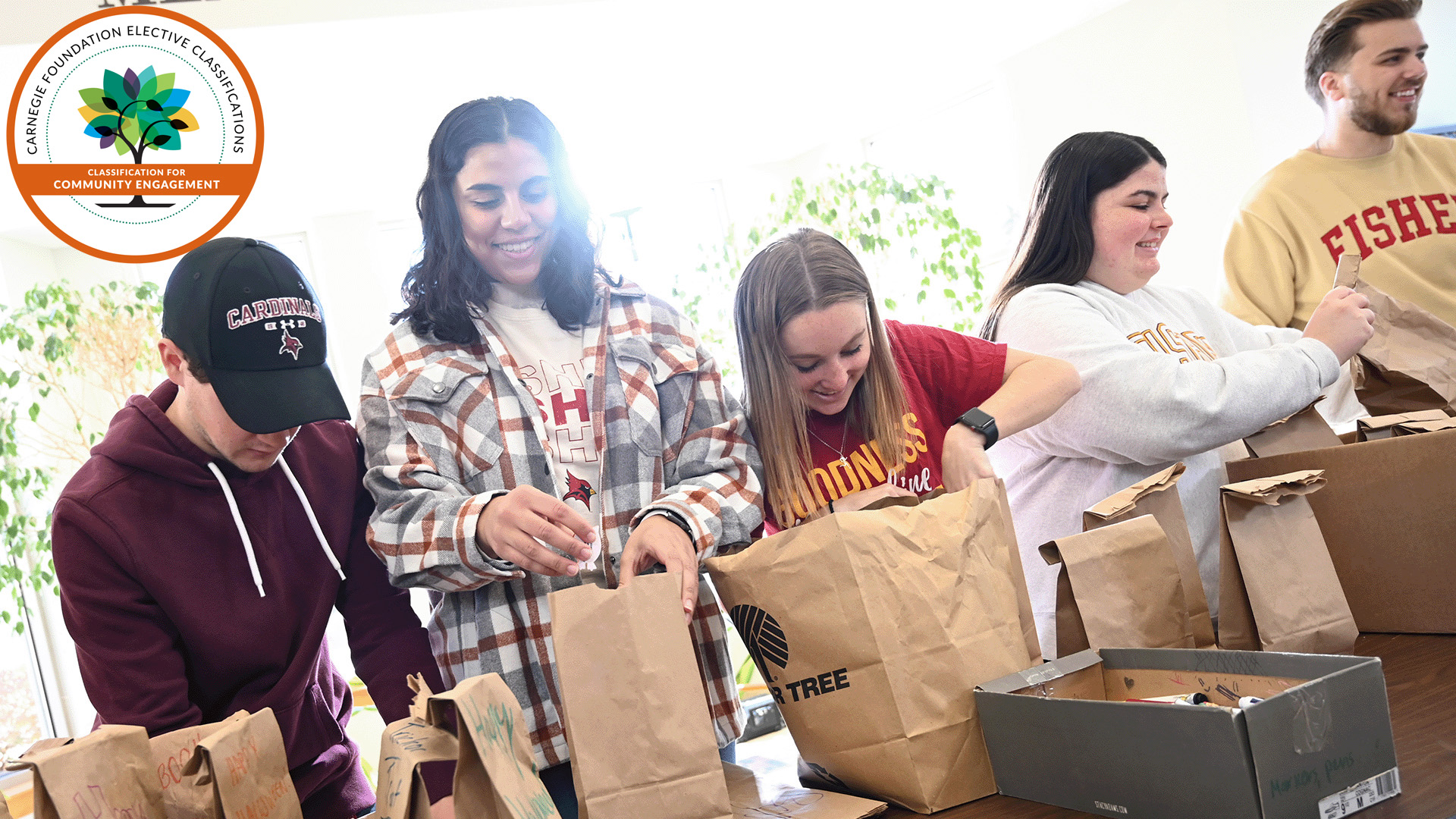 The Carnegie Community Engagement Classification seal with an image of Fisher students volunteering.