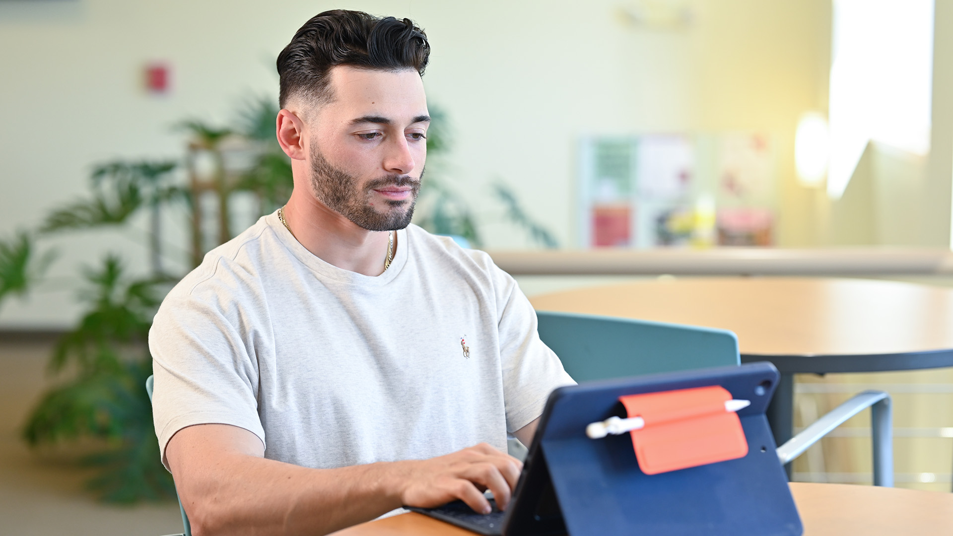 An MBA student works on an iPad.